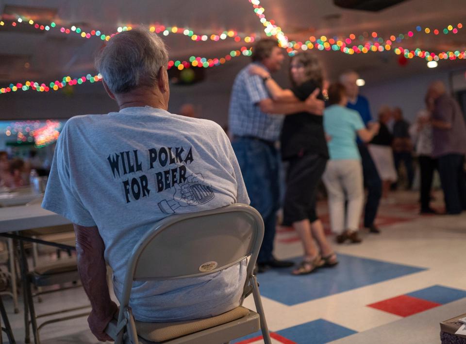 Bill White watches as people dance during a weekly polka dance held at the South Range Eagles Club in South Range on Sunday, July 23, 2023, in Michigan's Upper Peninsula.