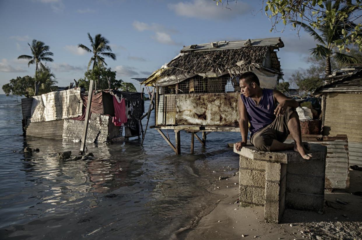   <span class="attribution"><a class="link " href="https://www.gettyimages.com.au/detail/news-photo/one-of-the-residents-of-the-village-eita-is-sitting-and-news-photo/495746020?adppopup=true" rel="nofollow noopener" target="_blank" data-ylk="slk:Getty Images;elm:context_link;itc:0;sec:content-canvas">Getty Images</a></span>