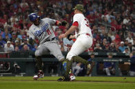 Los Angeles Dodgers' Miguel Rojas (11) is tagged out by St. Louis Cardinals starting pitcher Steven Matz during the fourth inning of a baseball game Friday, May 19, 2023, in St. Louis. (AP Photo/Jeff Roberson)