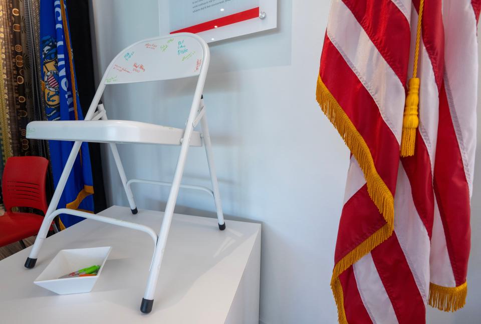 Introduced in 1941, Krueger International became known for stackable metal chairs like this on shown at Krueger International Inc. in Green Bay, Wis. This chair in the lobby is autographed by customers and visitors. The company specializes in furniture for educational institutions and offices. The employee-owned company is known locally as KI.