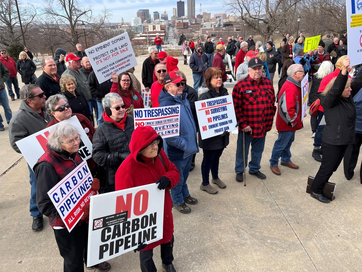 Iowans gather at a rally at the Iowa Capitol on Feb. 21, 2023 in opposition to the use of eminent domain by carbon capture pipelines in Iowa.