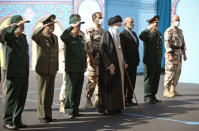 In this picture released by the official website of the office of the Iranian supreme leader, Supreme Leader Ayatollah Ali Khamenei, center, attends a graduation ceremony of a group of armed forces cadets accompanied by commanders of the armed forces, at the police academy in Tehran, Iran, Monday, Oct. 3, 2022. Khamenei responded publicly on Monday to the biggest protests in Iran in years, breaking weeks of silence to condemn what he called “rioting” and accuse the U.S. and Israel of planning the protests. (Office of the Iranian Supreme Leader via AP)