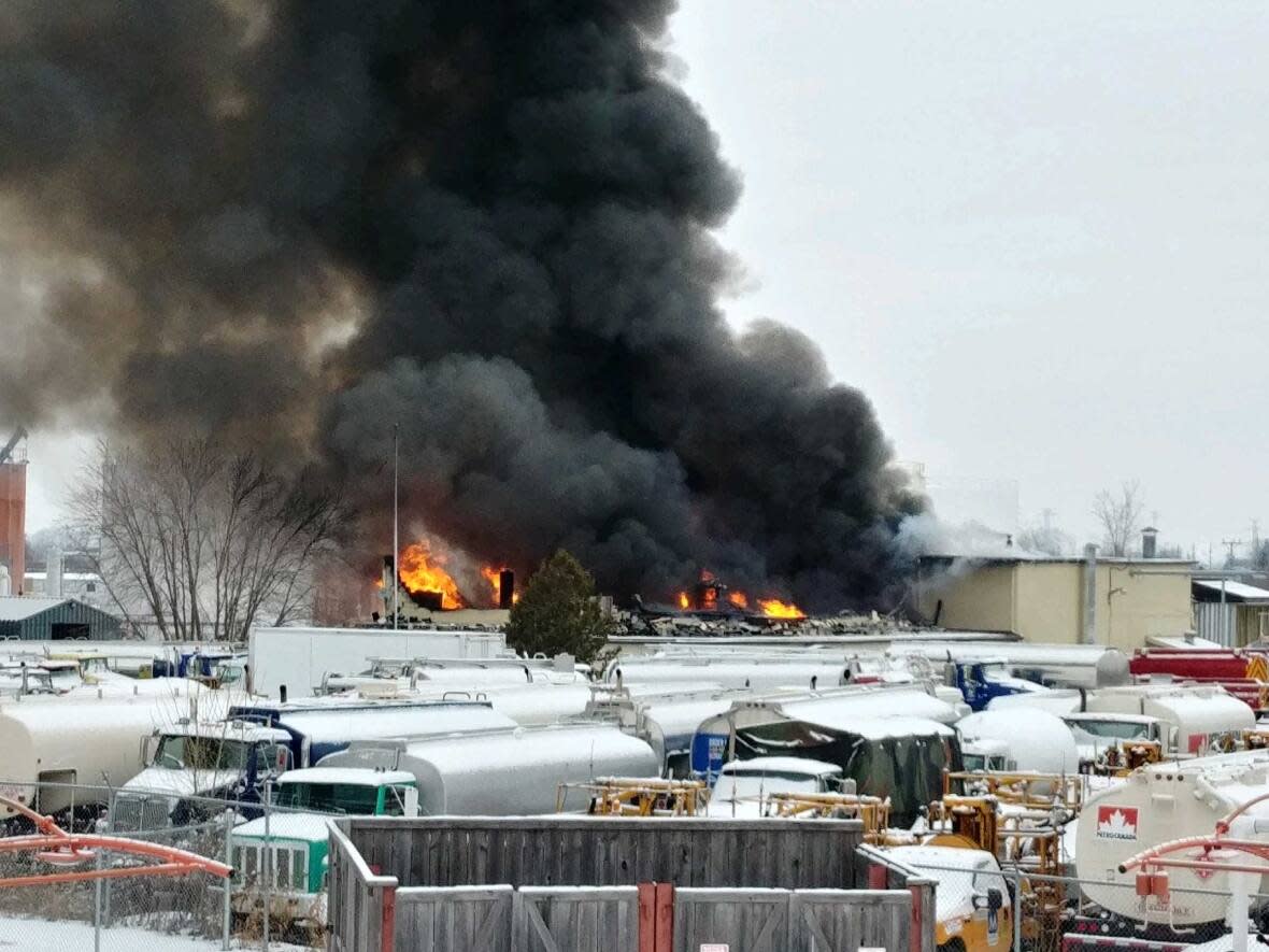 An eyewitness took this photo Thursday of the blaze at the Merivale Road site of Eastway Tank, Pump and Meter. Ontario's regulator for fuels, boilers, pressure vessels and elevating devices is now investigating the fatal fire and explosion, believed to have killed six people. (courtesy Ty Littleton - image credit)