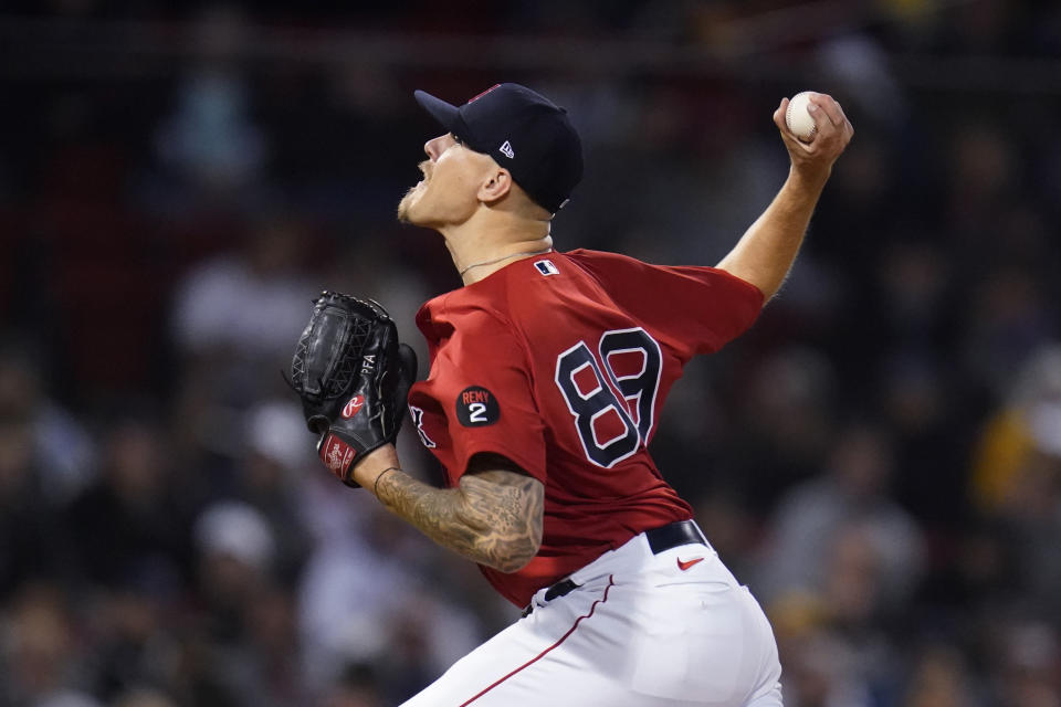 Boston Red Sox pitcher Tanner Houck delivers during the eighth inning of the team's baseball game against the Cincinnati Reds, Wednesday, June 1, 2022, at Fenway Park in Boston. (AP Photo/Charles Krupa)