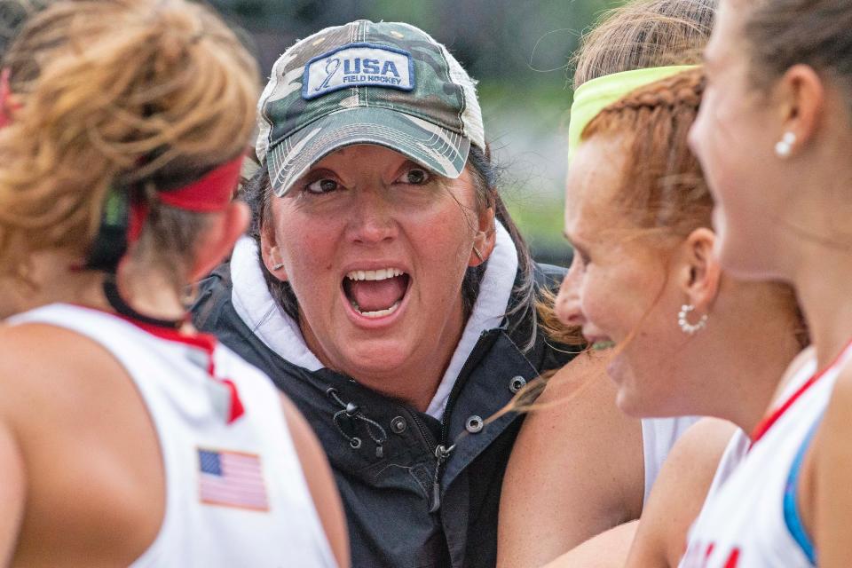 Smyrna head coach Loveita Moffett congratulates the team on their historic 3-2 victory over Delmar ending Delmar's 120-game winning streak during the field hockey game at Smyrna High, Tuesday, Sept. 26, 2023.