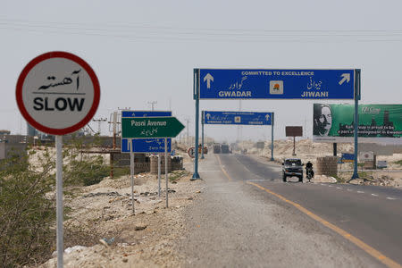 FILE PHOTO: A general view of signs along a highway leading to Gwadar, Pakistan April 12, 2017. Picture taken April 12, 2017. REUTERS/Akhtar Soomro