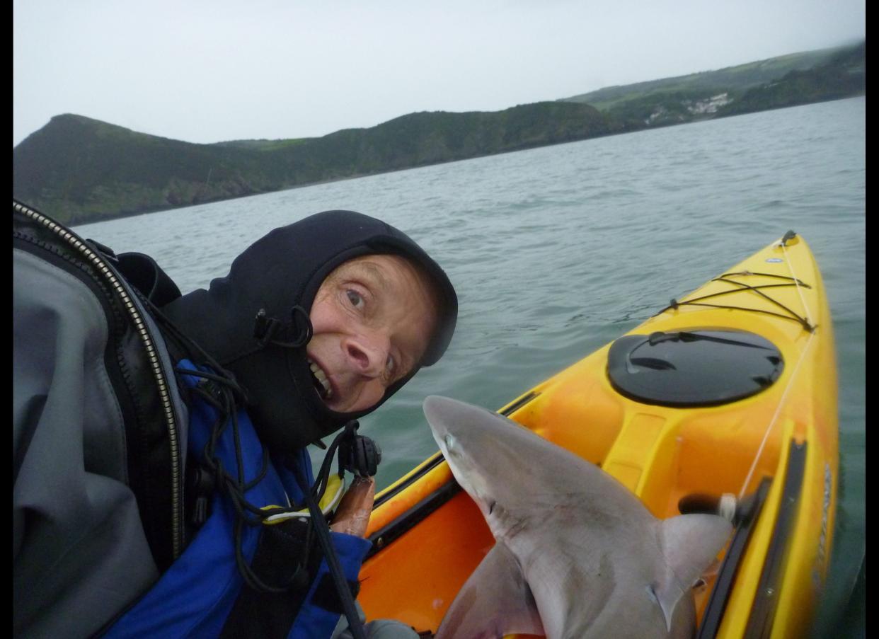 This is the jaw-dropping moment a canoeist landed a 6-foot shark after it dragged him through the water for 10 minutes. Brave Rupert Kirkwood, 51, had paddled a mile off the United Kingdom's Devon coast when he suddenly felt a snag on his line. The 70-pound beast nearly pulled him overboard, before pulling his 16-foot canoe through the water as he desperately clung on. After 10 minutes of wrestling with the beast, he eventually hauled the massive fish on board.