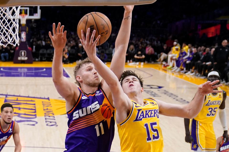 Los Angeles Lakers guard Austin Reaves, right, went 12-for-13 from the free-throw line on Wednesday night. The Phoenix Suns shot 20 free throws as a team.