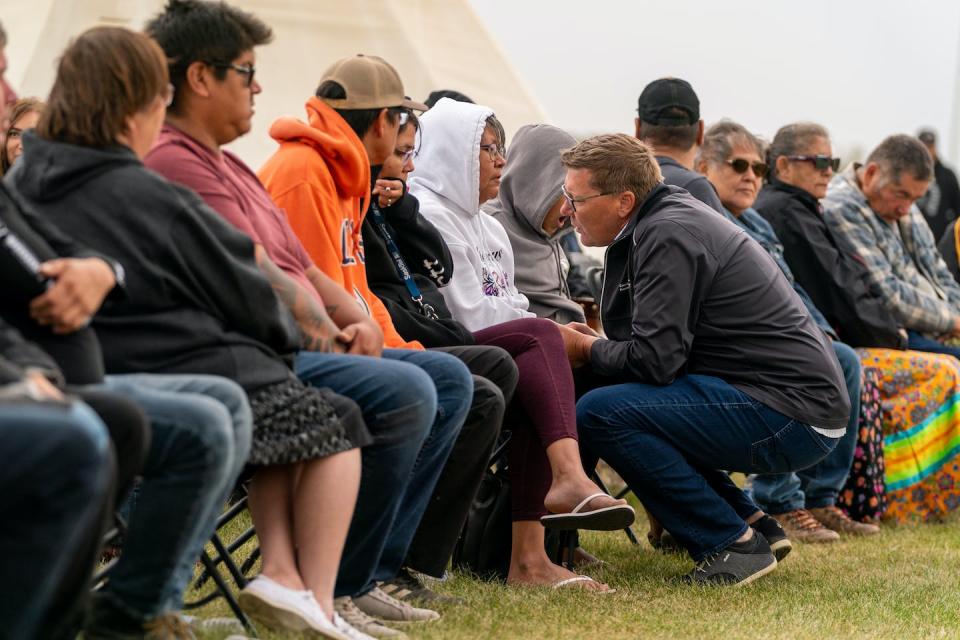 Premier of Saskatchewan Scott Moe speaks with victims’ family members during a Federation of Sovereign Indigenous Nations event where leaders provide statements about the mass stabbing incident that happened at James Smith Cree Nation. THE CANADIAN PRESS/Heywood Yu