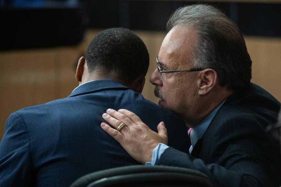 Defense attorney Marc Shiner speaks with his client, former Florida State University football player Travis Rudolph, while waiting for the jury to deliver its verdict in Rudolph's murder case on Wednesday, June 7, 2023, in the Palm Beach County Courthouse in downtown West Palm Beach, Fla.