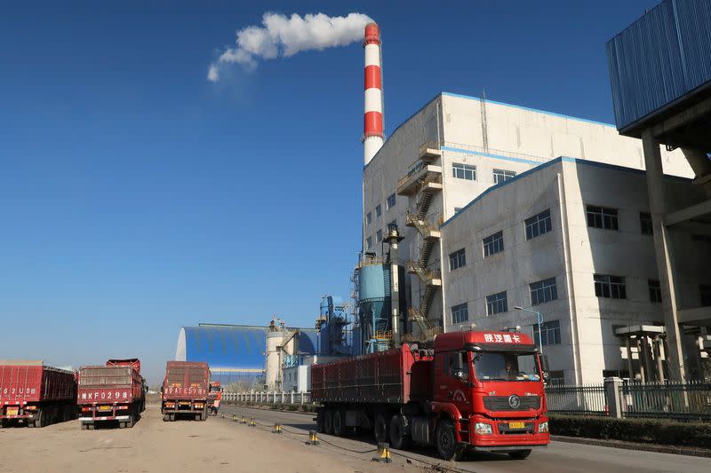 FILE PHOTO: Truck passes by a chemical factory near the Jinjie Industrial Park in Shenmu