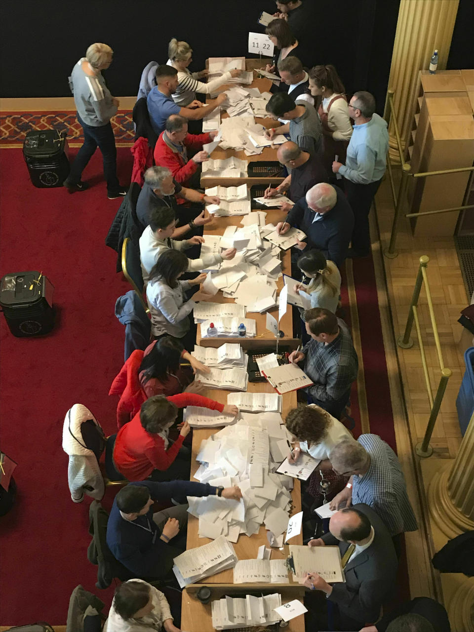 Counting in the local government elections begins at Belfast City Hall, Northern Ireland, Friday May 3, 2019. Elections were held Thursday for more than 8,000 seats on 259 local authorities across England — although not in London — and Northern Ireland. (Rebecca Black/PA via AP)