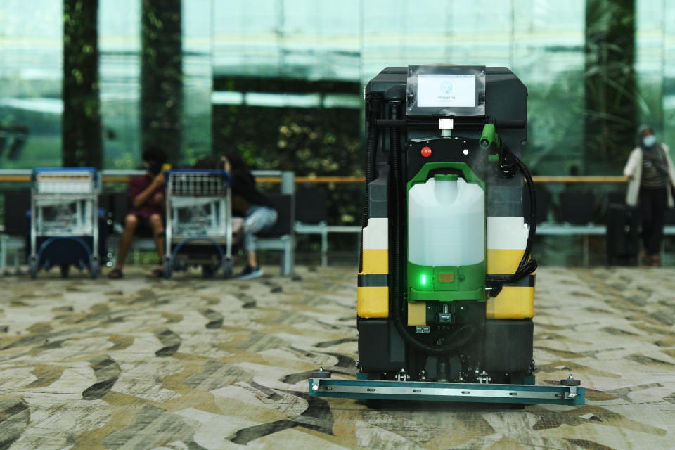 SINGAPORE, July 1, 2020 -- An automatic cleaning robot equipped with disinfectant spray attachment works in Singapore's Changi Airport on July 1, 2020. (Photo by Then Chih Wey/Xinhua via Getty) (Xinhua/ via Getty Images)