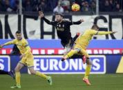 Football Soccer - Frosinone v Juventus - Serie A - Matusa Stadium, Frosinone, Italy - 07/02/16. Juventus' Andrea Barzagli (C) and Frosinone's Federico Dionisi (R) in action. REUTERS/Max Rossi