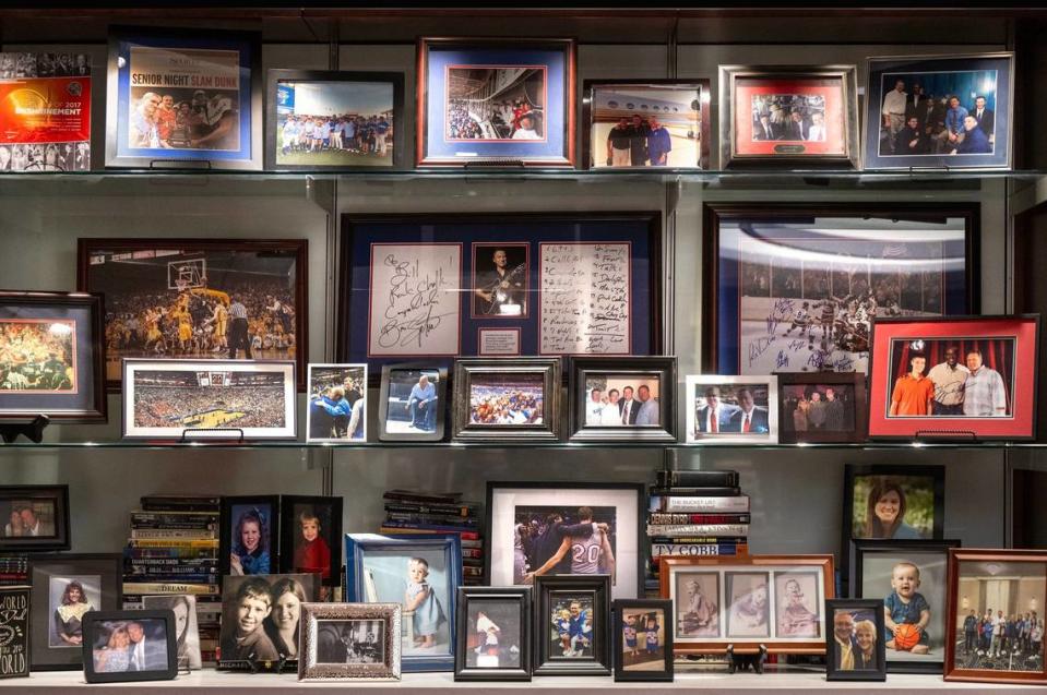 Photographs of family, friends and other memories adorn Bill Self’s office.