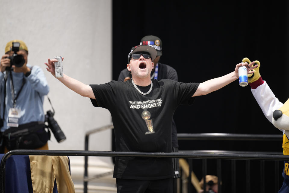 Denver Nuggets head coach Michael Malone celebrates during a rally and parade to mark the team's first NBA basketball championship on Thursday, June 15, 2023, in Denver. (AP Photo/David Zalubowski)