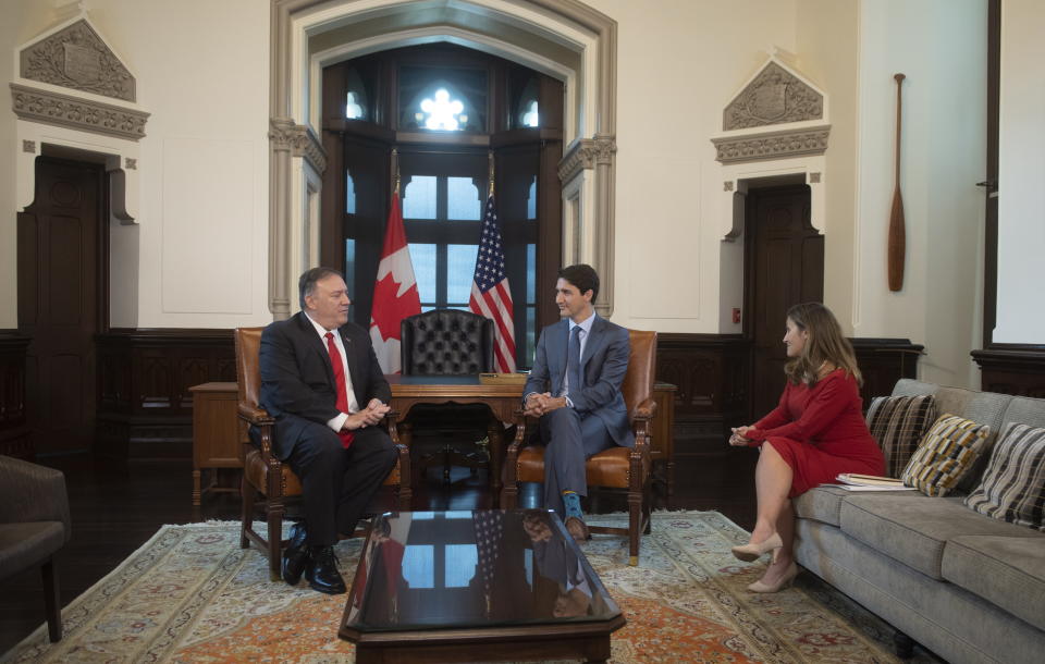 Canadian Prime Minister Justin Trudeau and Minister of Foreign Affairs Chrystia Freeland meet with U.S. Secretary of State Mike Pompeo on Parliament Hill in Ottawa, Thursday Aug. 22, 2019. (Adrian Wyld/The Canadian Press via AP)