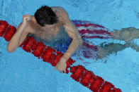 Robert Finke, of the United States, celebrates after winning the gold medal in the men's 1500-meter freestyle final at the 2020 Summer Olympics, Sunday, Aug. 1, 2021, in Tokyo, Japan. (AP Photo/Jeff Roberson)