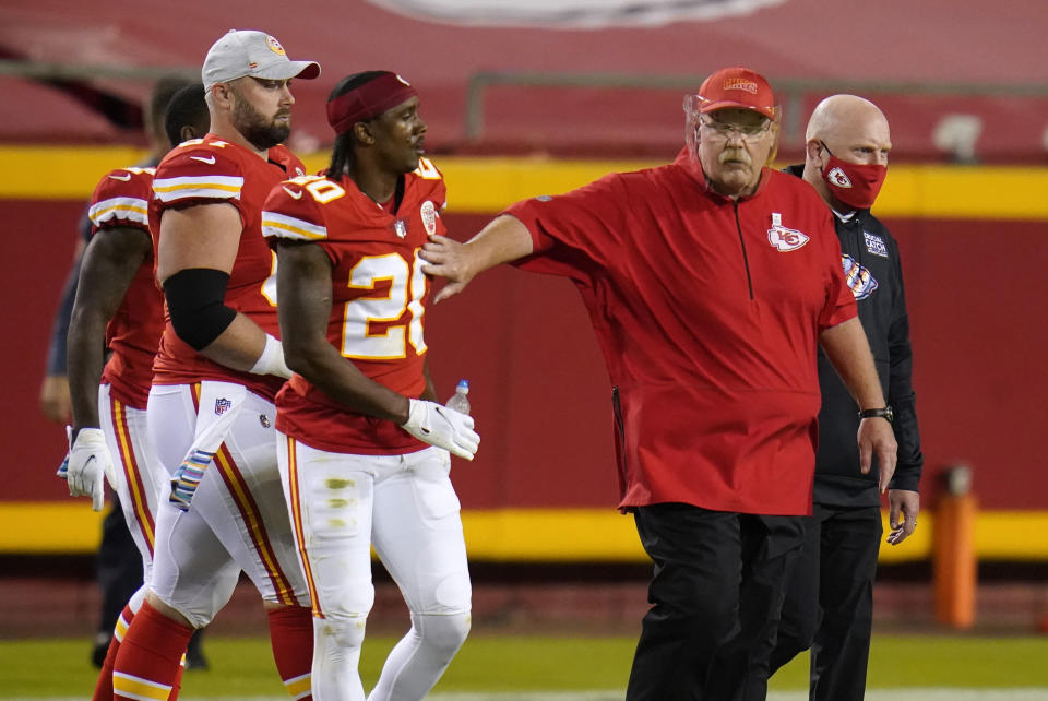 Kansas City Chiefs head coach Andy Reid, right, walks off the field with cornerback Antonio Hamilton (20) after an NFL football game against the New England Patriots, Monday, Oct. 5, 2020, in Kansas City. The Chiefs won 26-10. (AP Photo/Jeff Roberson)