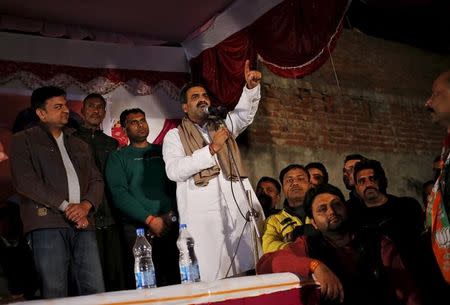 Sanjeev Balyan (C), agriculture minister and a member of ruling Bharatiya Janata Party (BJP), addresses a by-election campaign rally in Muzaffarnagar district in Uttar Pradesh, February 9, 2016. REUTERS/Anindito Mukherjee
