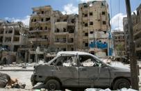 The damaged Al-Quds hospital building (R), pictured following airstrikes on the rebel-held neighbourhood of Sukkari in Aleppo