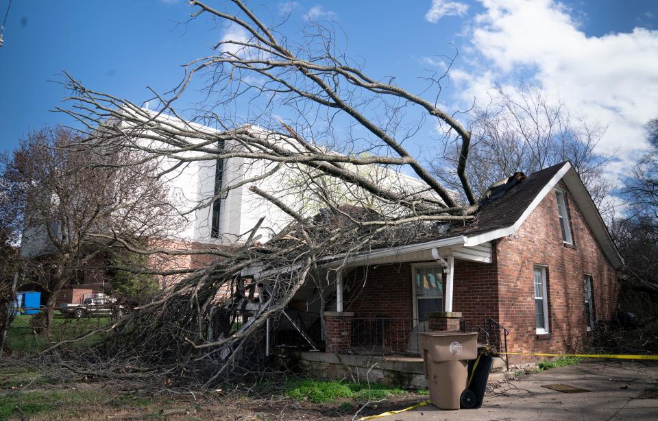 A tree fell through a house along Meharry Blvd. as severe weather and strong winds blew through Nashville, Tenn. Friday, March 3, 2023. 