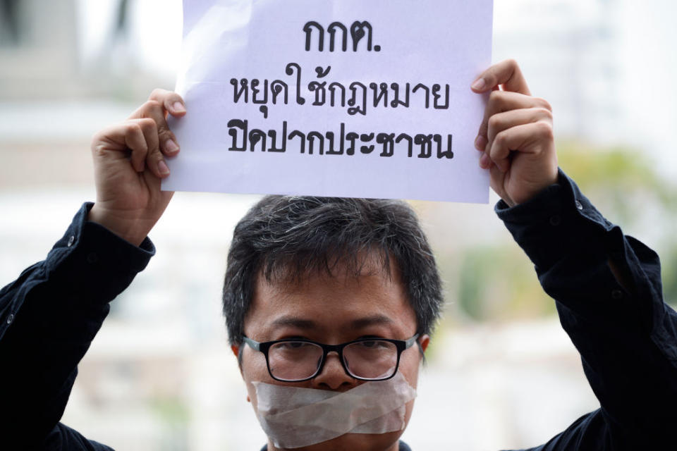 Human rights lawyer Arnon Nampa holds a poster during election protests in Bangkok, Thailand on April 7, 2019.<span class="copyright">Anusak Laowilas—NurPhoto/Getty Images</span>
