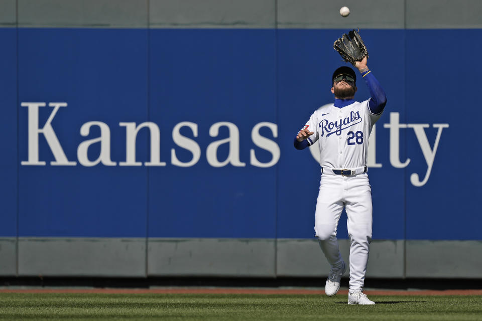 Kansas City Royals center fielder Kyle Isbel catches a fly ball for the out on Minnesota Twins' Max Kepler during the third inning of a baseball game Thursday, March 28, 2024, in Kansas City, Mo. (AP Photo/Charlie Riedel)