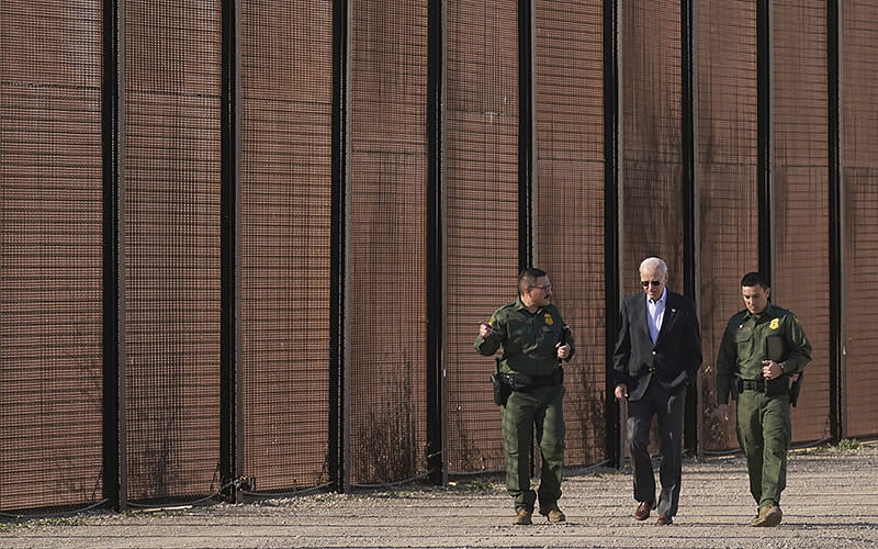 President Biden walks with U.S. Border Patrol agents along a stretch of the U.S.-Mexico border in El Paso, Texas