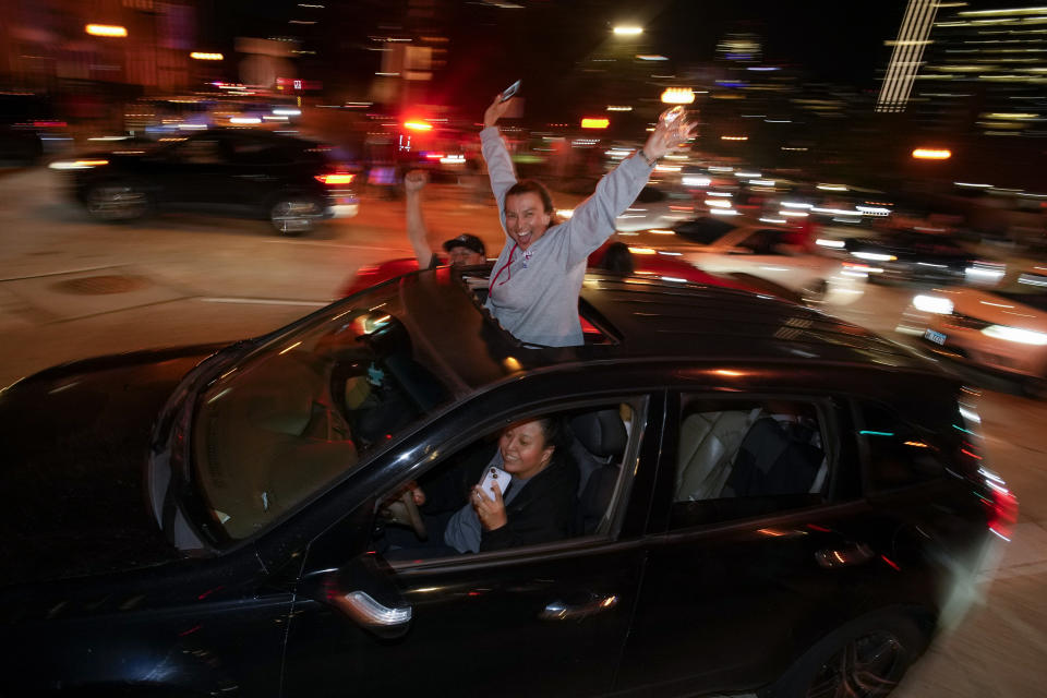 People celebrate after the Denver Nuggets won the NBA Championship with a victory over the Miami Heat in Game 5 of basketball's NBA Finals, late Monday, June 12, 2023, in Denver. (AP Photo/David Zalubowski)