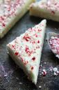 <p>To get the fluffiest frosting for these chewy bars, whip the butter base for at least two or three minutes.</p><p><strong>Get the recipe at <a href="https://www.lecremedelacrumb.com/peppermint-crunch-sugar-cookie-bars/" rel="nofollow noopener" target="_blank" data-ylk="slk:Creme de la Crumb;elm:context_link;itc:0;sec:content-canvas" class="link ">Creme de la Crumb</a>.</strong> </p>