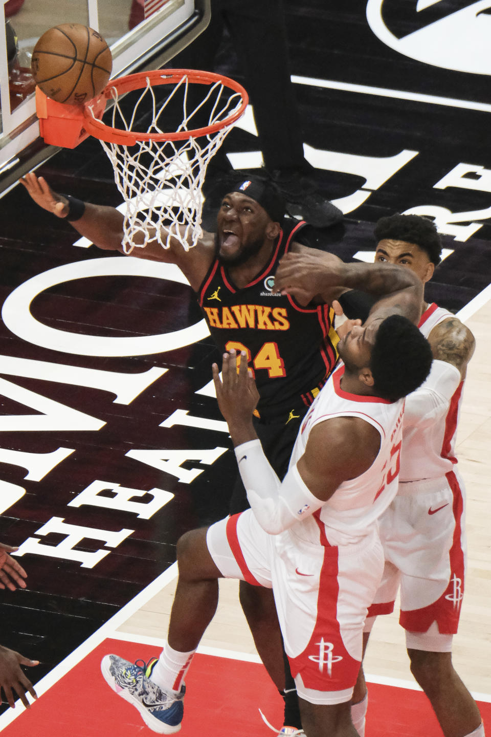 Atlanta Hawks forward Bruno Fernando (24) reacts to missing a shot against the Houston Rockets during the first half of an NBA basketball game on Sunday, May 16, 2021, in Atlanta. (AP Photo/Ben Gray)