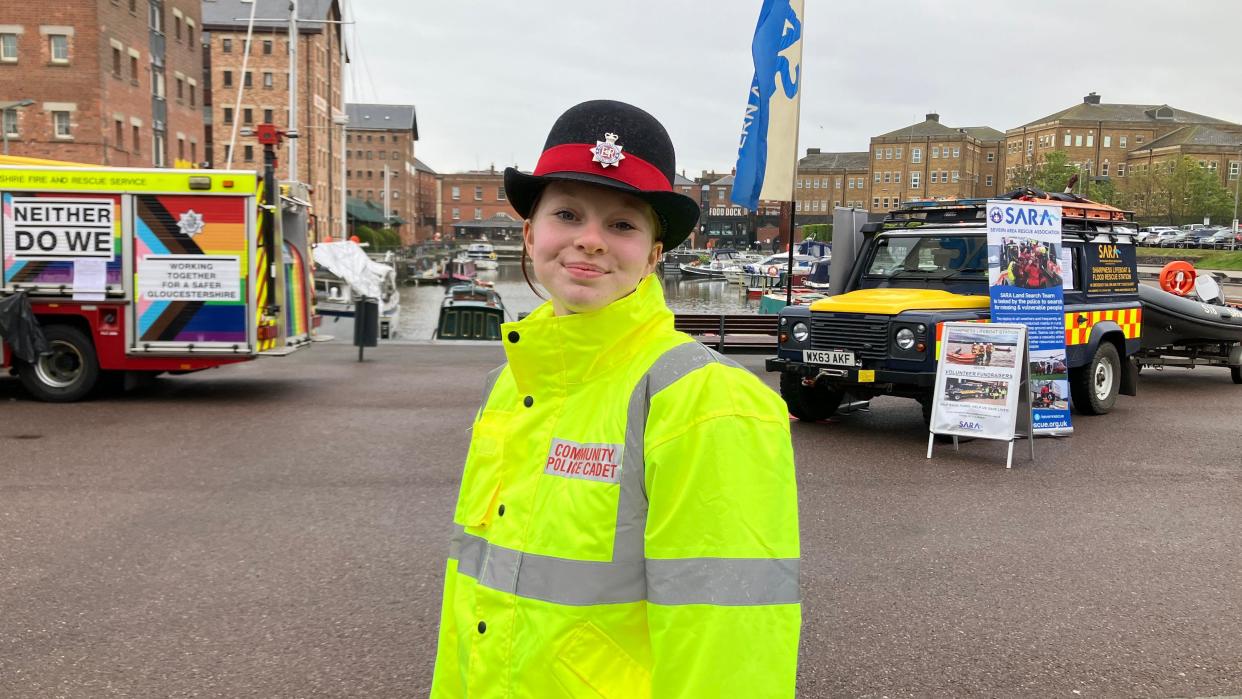 Police cadet Maisie, 14, pictured standing at Gloucester Docks. 