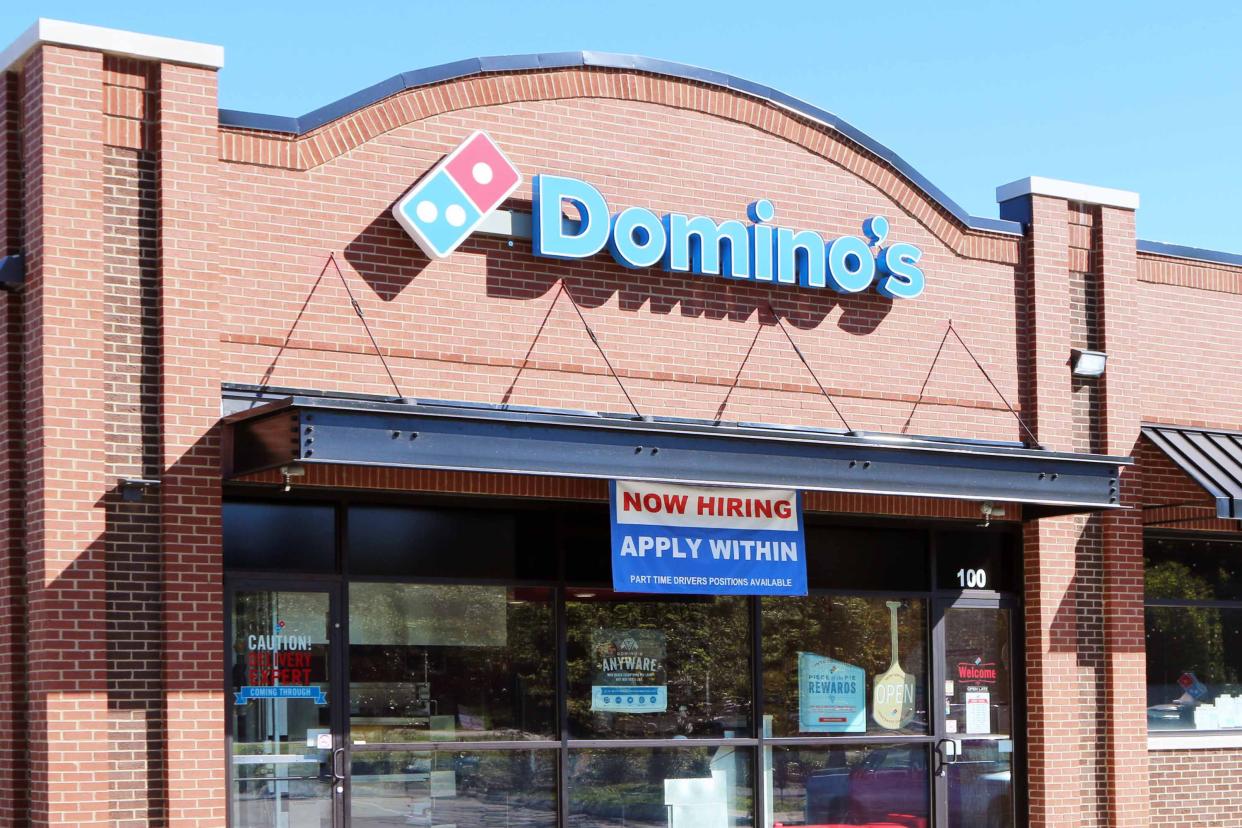 Franklin, Tennessee-October 5, 2015: New Domino's pizza franchise with "Now Hiring" sign in the window
