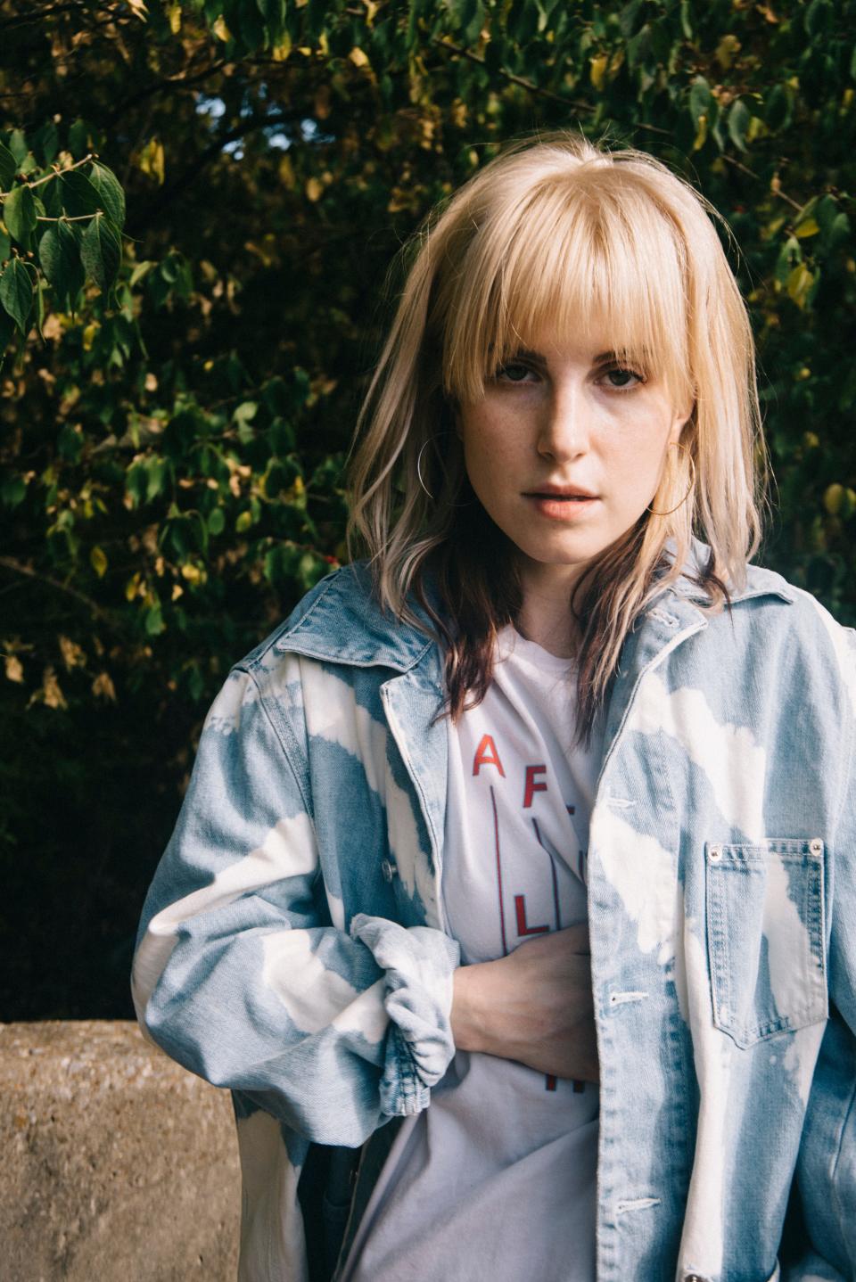 Hayley Williams, who rose to fame as the lead singer of Paramore, will release her first solo album "Petals For Armor" on Friday.