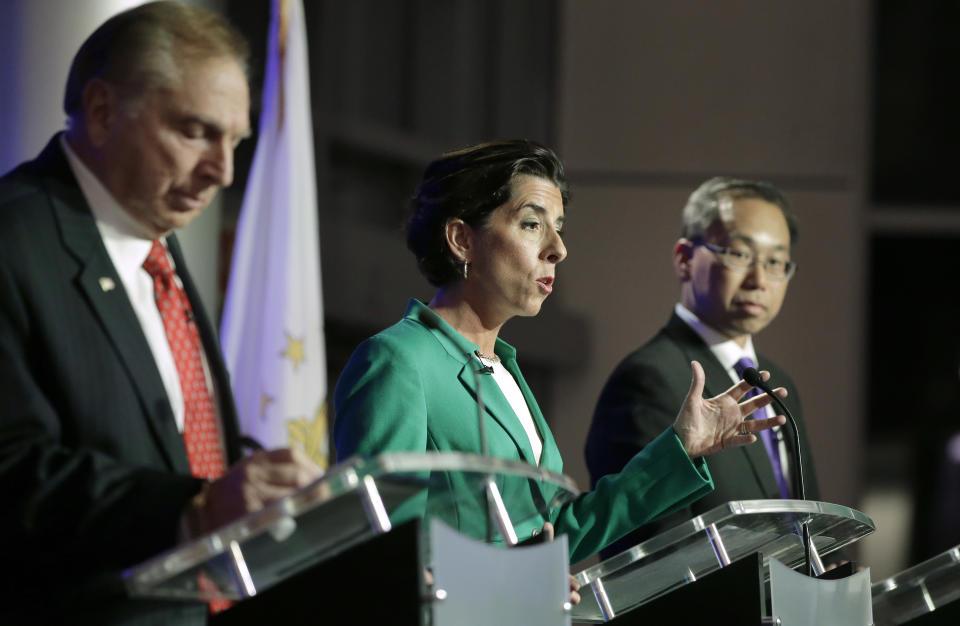 Rhode Island gubernatorial candidates former state Rep. Joseph Trillo, who is running as an independent, left, Democratic Gov. Gina Raimondo, center, and Republican Cranston Mayor Allan Fung, right, participate in a debate, Thursday, Sept. 27, 2018, in Bristol, R.I. (AP Photo/Steven Senne)
