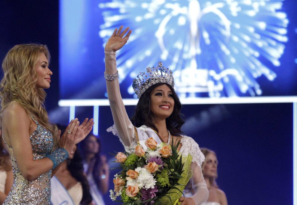 Miss Supranational Mutya Johanna Datul (C) makes her first hand wave as the contest's reigning beauty queen. The Isabela lass is expected to arrive in Manila Monday (September 9) with her crown, sash and USD 25,000 cash prize. REUTERS/Vasily Fedosenko