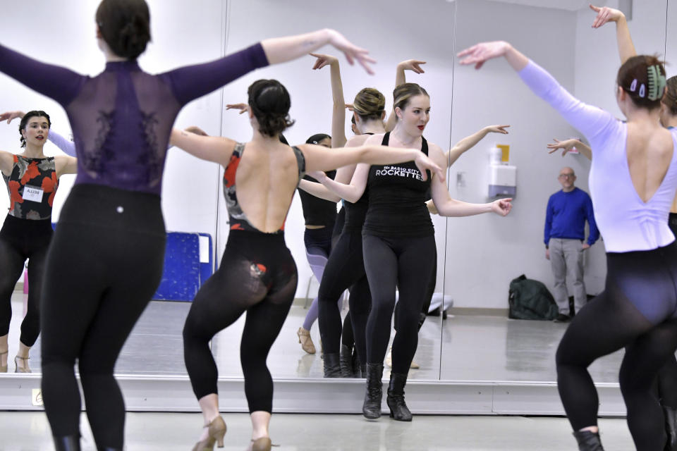 Amarisa LeBar, center, a Radio City Rockette, leads students in a Rockettes Precision Dance Technique course on Wednesday, Feb. 8, 2023, at the Boston Conservatory at Berklee in Boston. (AP Photo/Josh Reynolds)