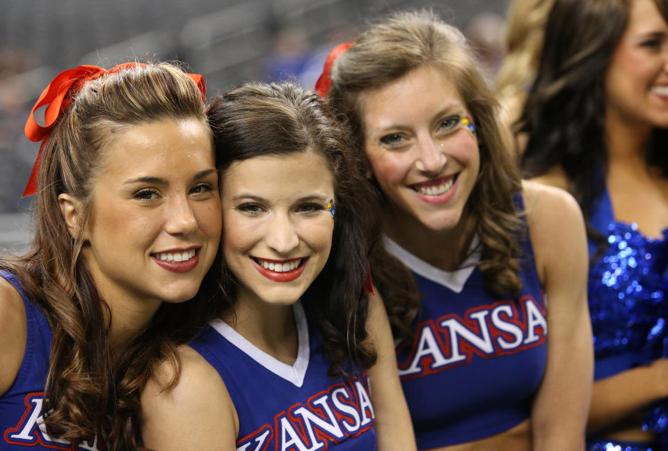 NEW ORLEANS, LA - MARCH 30: Kansas Jayhawks cheerleaders pose during practice prior to the 2012 Final Four of the NCAA Division I Men's Basketball Tournament at the Mercedes-Benz Superdome on March 30, 2012 in New Orleans, Louisiana. (Photo by Ronald Martinez/Getty Images)