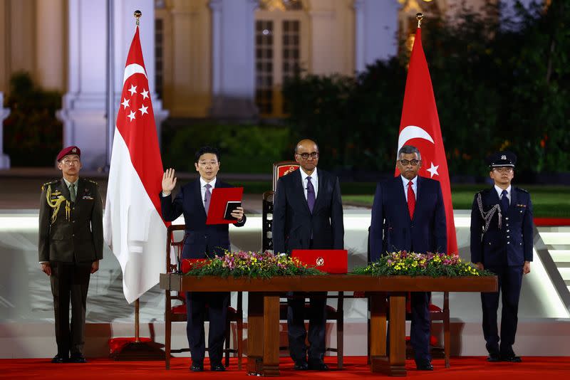 Singapore's Deputy Prime Minister and Minister of Finance Lawrence Wong is sworn in as Singapore's fourth Prime Minister