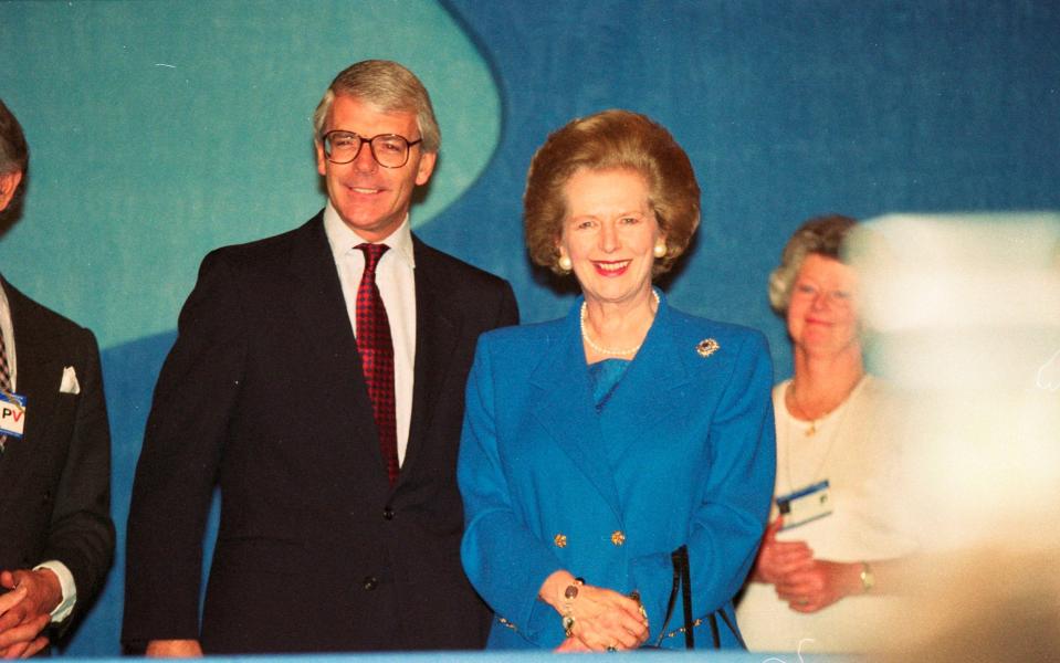 Margaret Thatcher, pictured alongside John Major at the 1993 Conservative Party Conference - Credit: James Fraser for The Telegraph