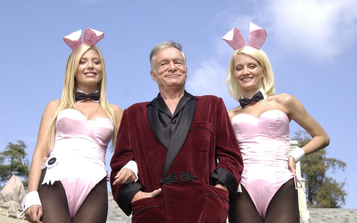 Playboy founder Hugh Hefner with 'bunnies' Sheila Levell and Holly Madison in 2003 - Robert Mora/Getty Images North America