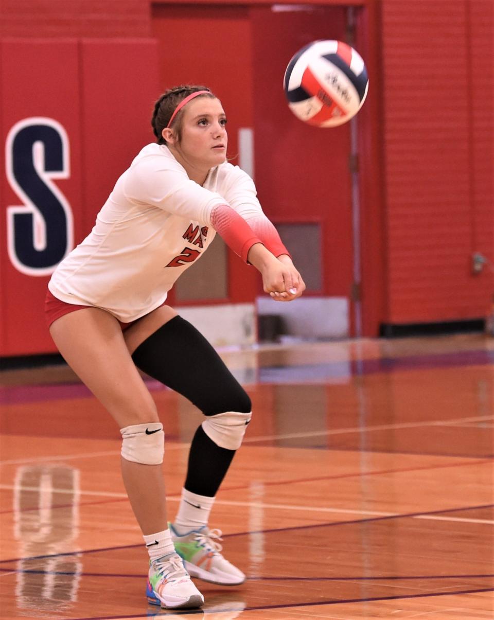 Eastland's Jaci Darr digs a Cooper shot during pool play at the Bev Ball Classic on Friday at Cougar Gym. Cooper beat the Lady Mavs 25-18, 25-20.