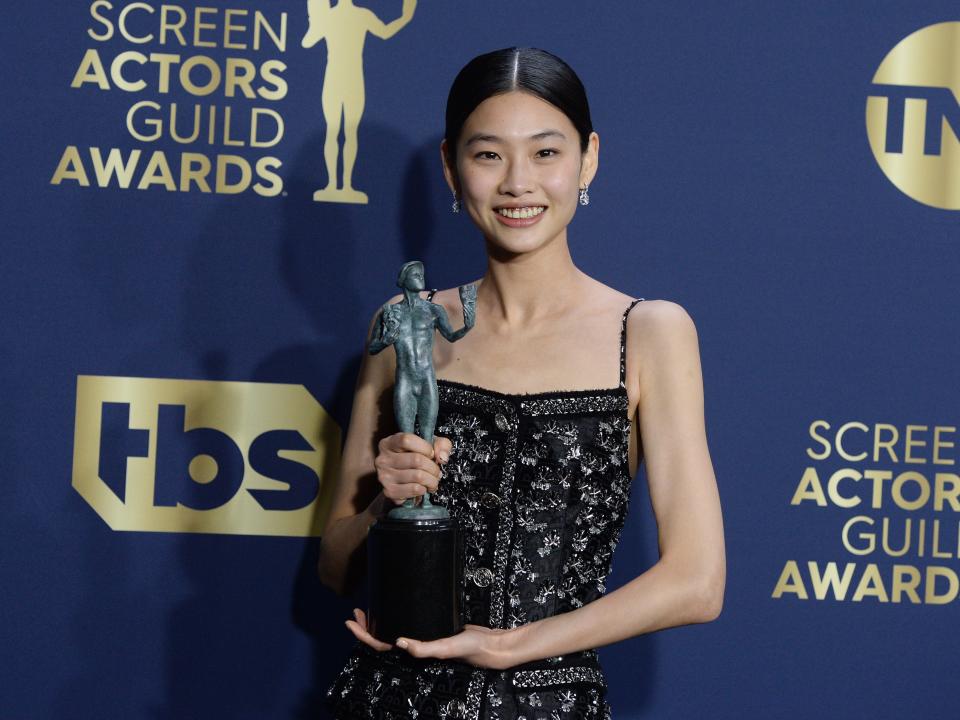 HoYeon Jung poses with her Screen Actors Guild Award in 2022.