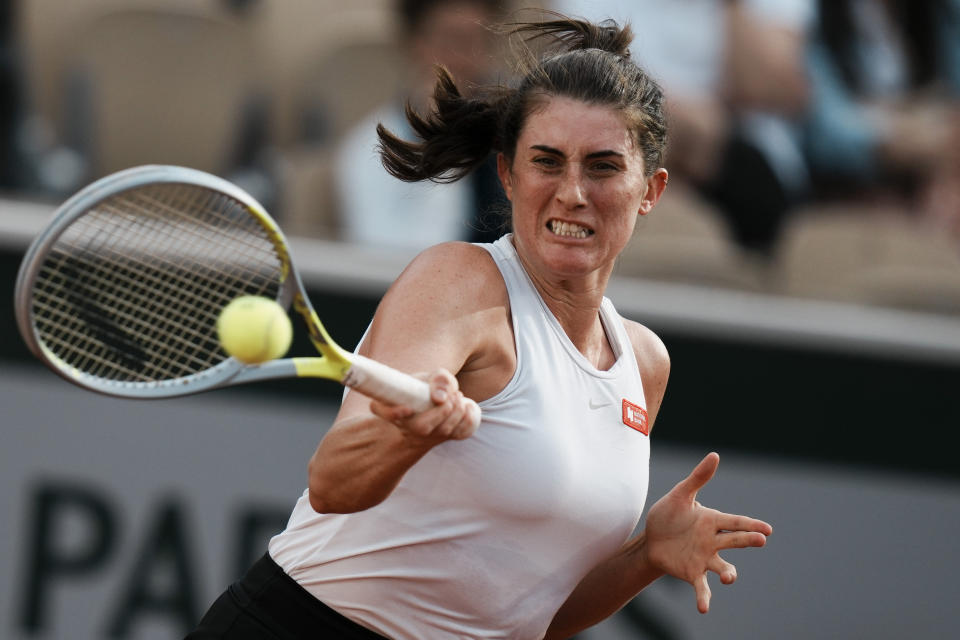 Canada's Rebecca Marino plays a shot against Coco Gauff of the U.S. during their first round match at the French Open tennis tournament in Roland Garros stadium in Paris, France, Sunday, May 22, 2022. (AP Photo/Thibault Camus)