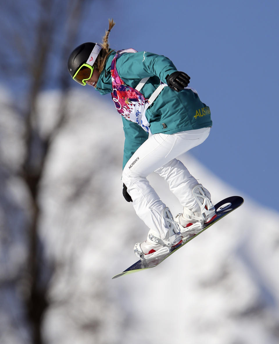 Australia's Torah Bright takes a jump during snowboard slope style training at the Rosa Khutor Extreme Park ahead of the 2014 Winter Olympics, Friday, Feb. 7, 2014, in Krasnaya Polyana, Russia. (AP Photo/Sergei Grits)