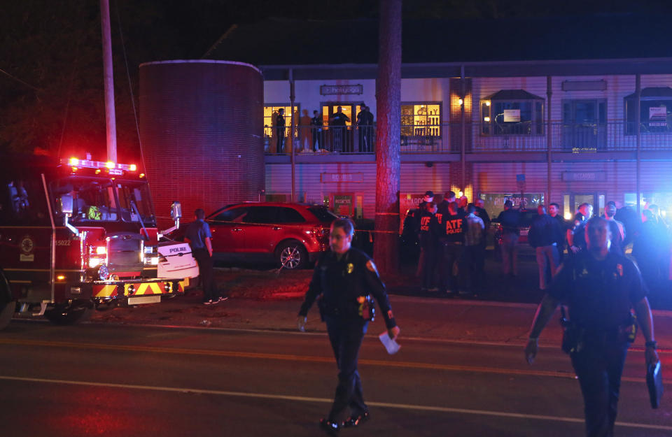 Police investigators work the scene of a shooting, Friday, November 2, 2018, in Tallahassee, Florida. A shooter killed one person and critically wounded four others at a yoga studio in Florida's capital before killing himself Friday, officials said. / Credit: Steve Cannon / AP