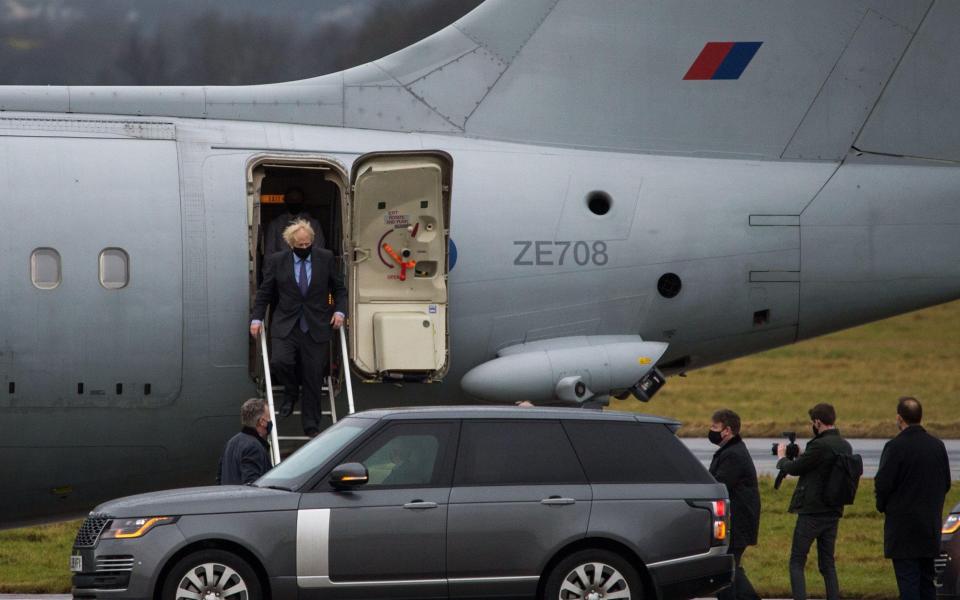 The UK Prime Minister Boris Johnson arrives off his plane at Glasgow Airport  - Alamy/Colin Fisher