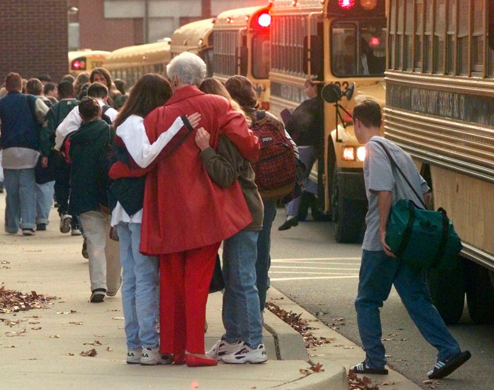 In this file photo from 1997, students arrived at Heath High School in West Paducah, Kentucky, a day after a gunman opened fire at the school, killing three students and injuring five.