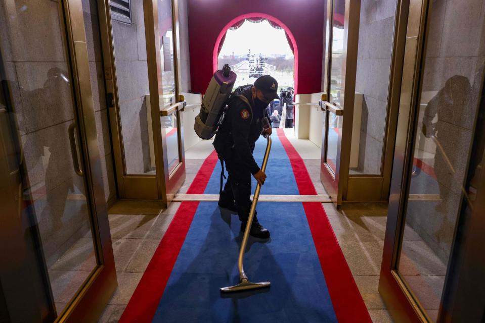 A man vacuums inside the U.S. Capitol ahead of the inauguration of Joe Biden as the 46th president of the United States on the West Front of the U.S. Capitol on January 20, 2021 in Washington, D.C.